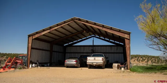 a front view of a house with parking space