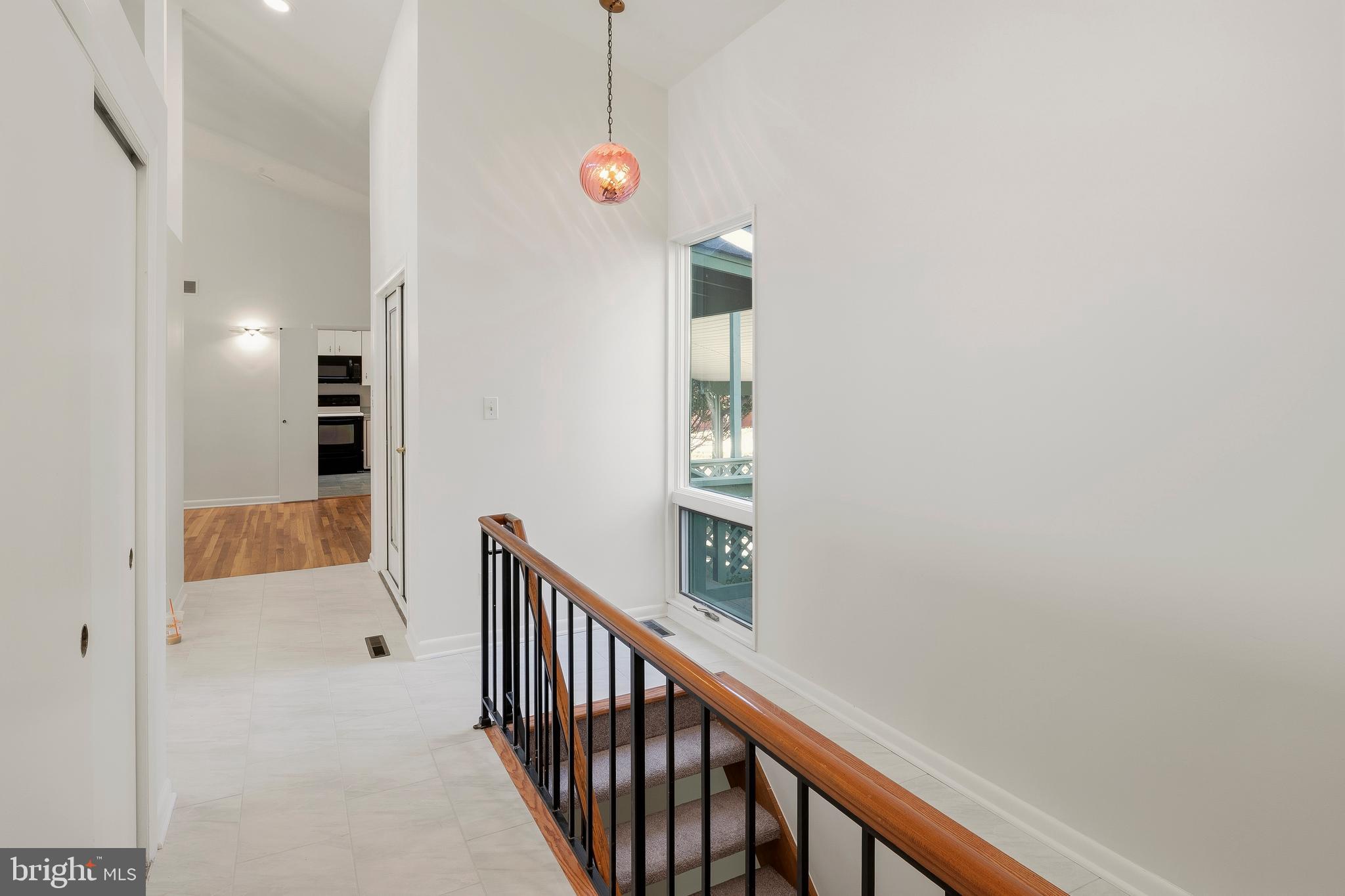 11089 Swansfield Road Columbia, MD 21044 - Photo 33 of 54 Foyer / Hallway and Steps to Lower Level