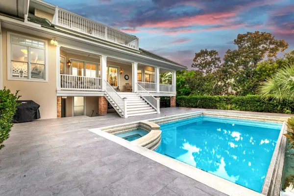 a view of swimming pool with outdoor seating