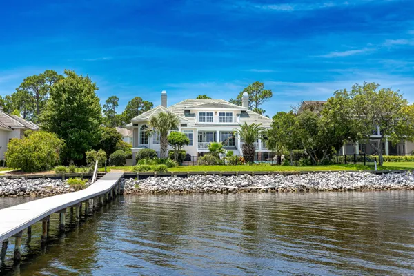 an aerial view of a house with a lake view