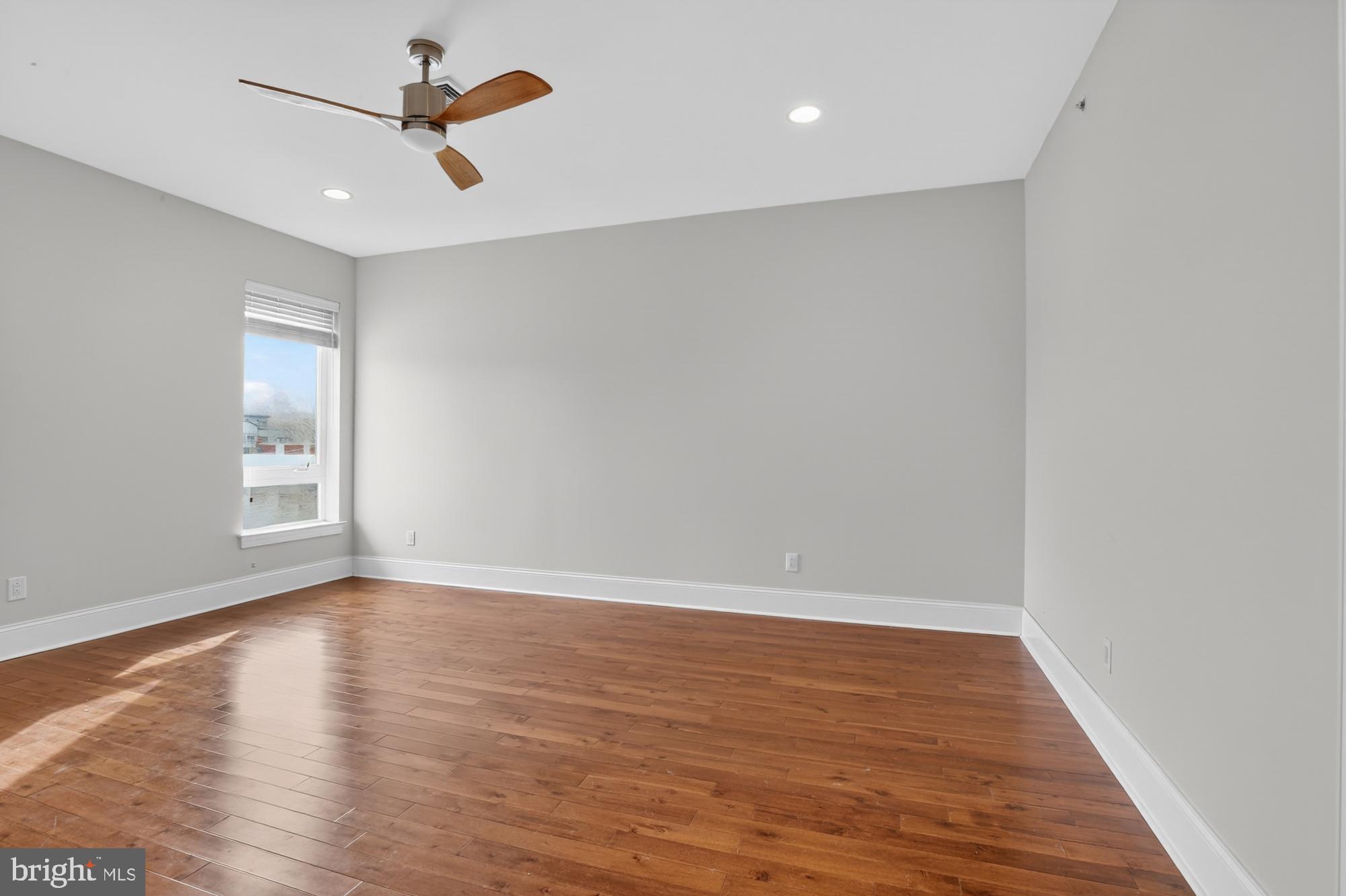 946 North 2nd Street, Unit 5 Philadelphia, PA 19123 - Photo 13 of 31 wooden floor in an empty room with a window