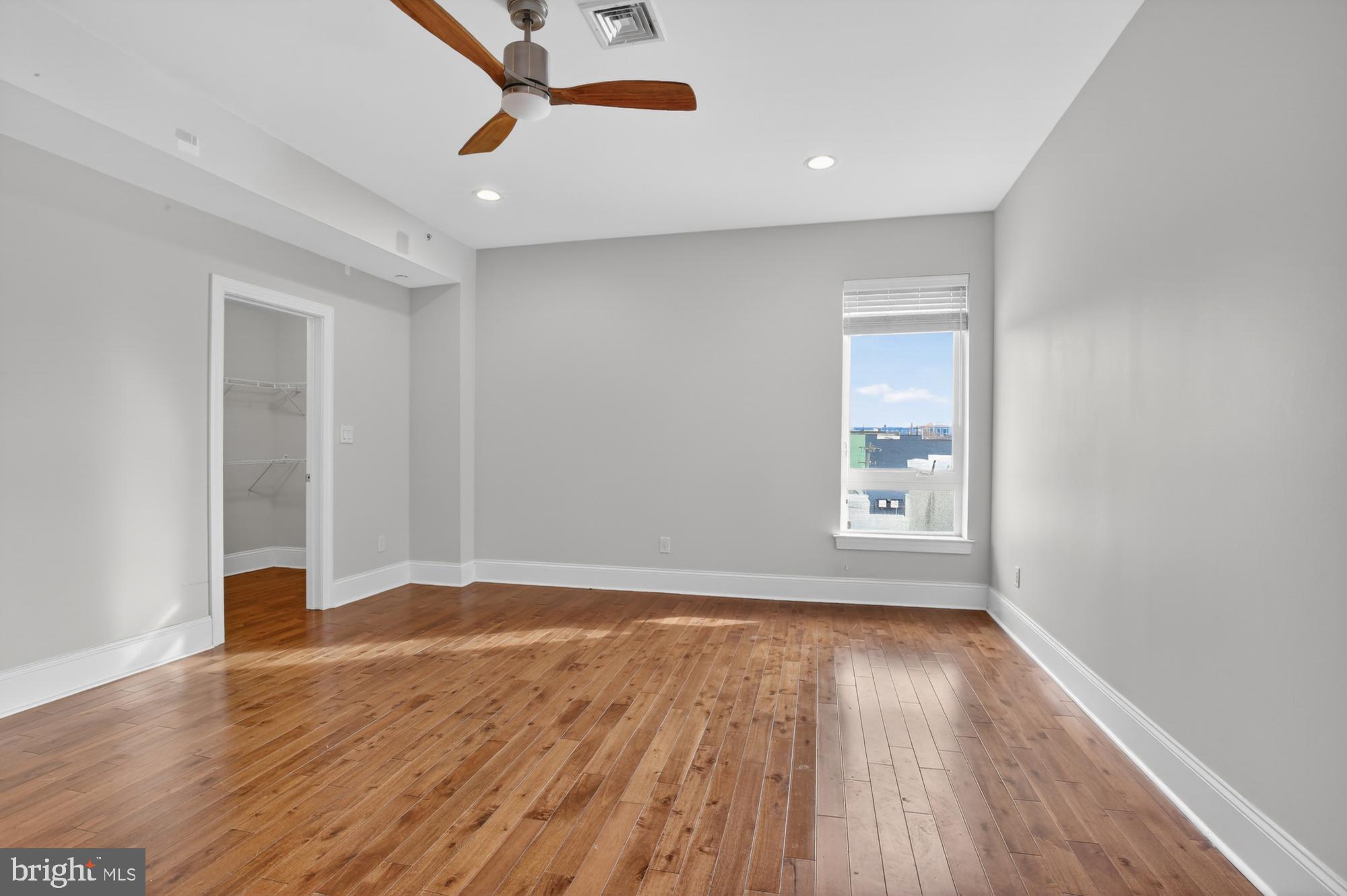 946 North 2nd Street, Unit 5 Philadelphia, PA 19123 - Photo 15 of 31 wooden floor in an empty room with a window