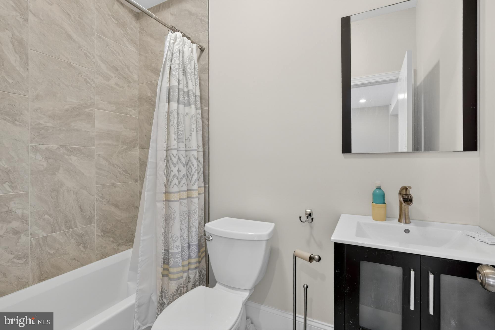 946 North 2nd Street, Unit 5 Philadelphia, PA 19123 - Photo 18 of 31 a bathroom with a sink a toilet and shower
