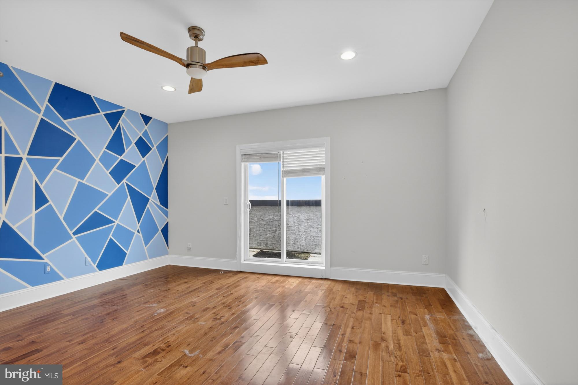 946 North 2nd Street, Unit 5 Philadelphia, PA 19123 - Photo 19 of 31 an empty room with wooden floor and windows