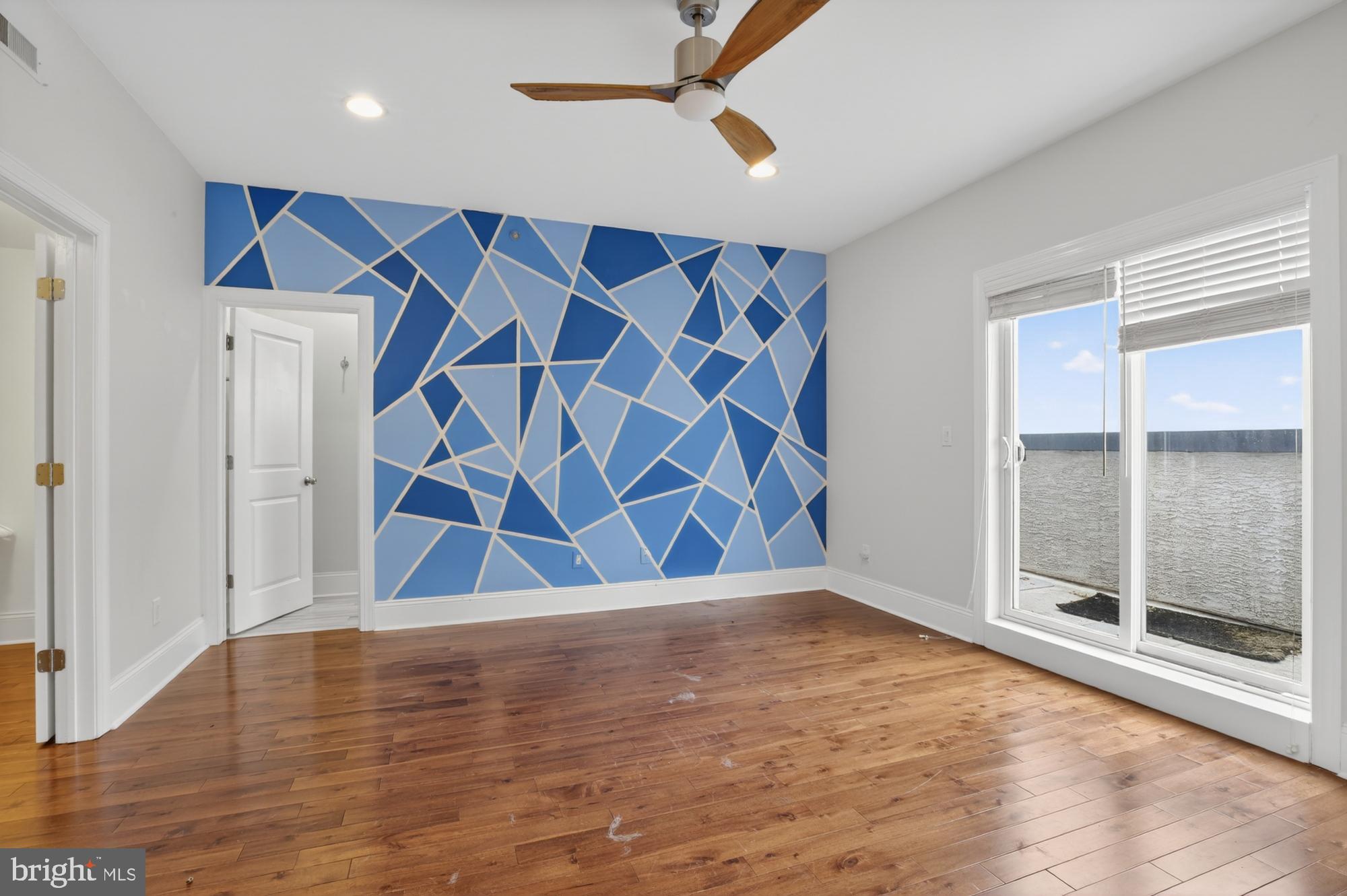 946 North 2nd Street, Unit 5 Philadelphia, PA 19123 - Photo 20 of 31 an empty room with wooden floor and windows