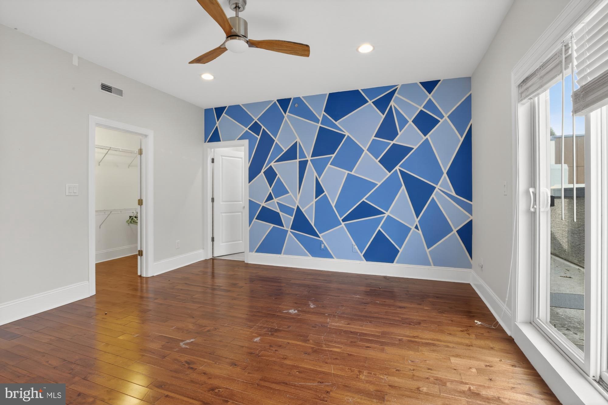 946 North 2nd Street, Unit 5 Philadelphia, PA 19123 - Photo 21 of 31 an empty room with wooden floor and windows