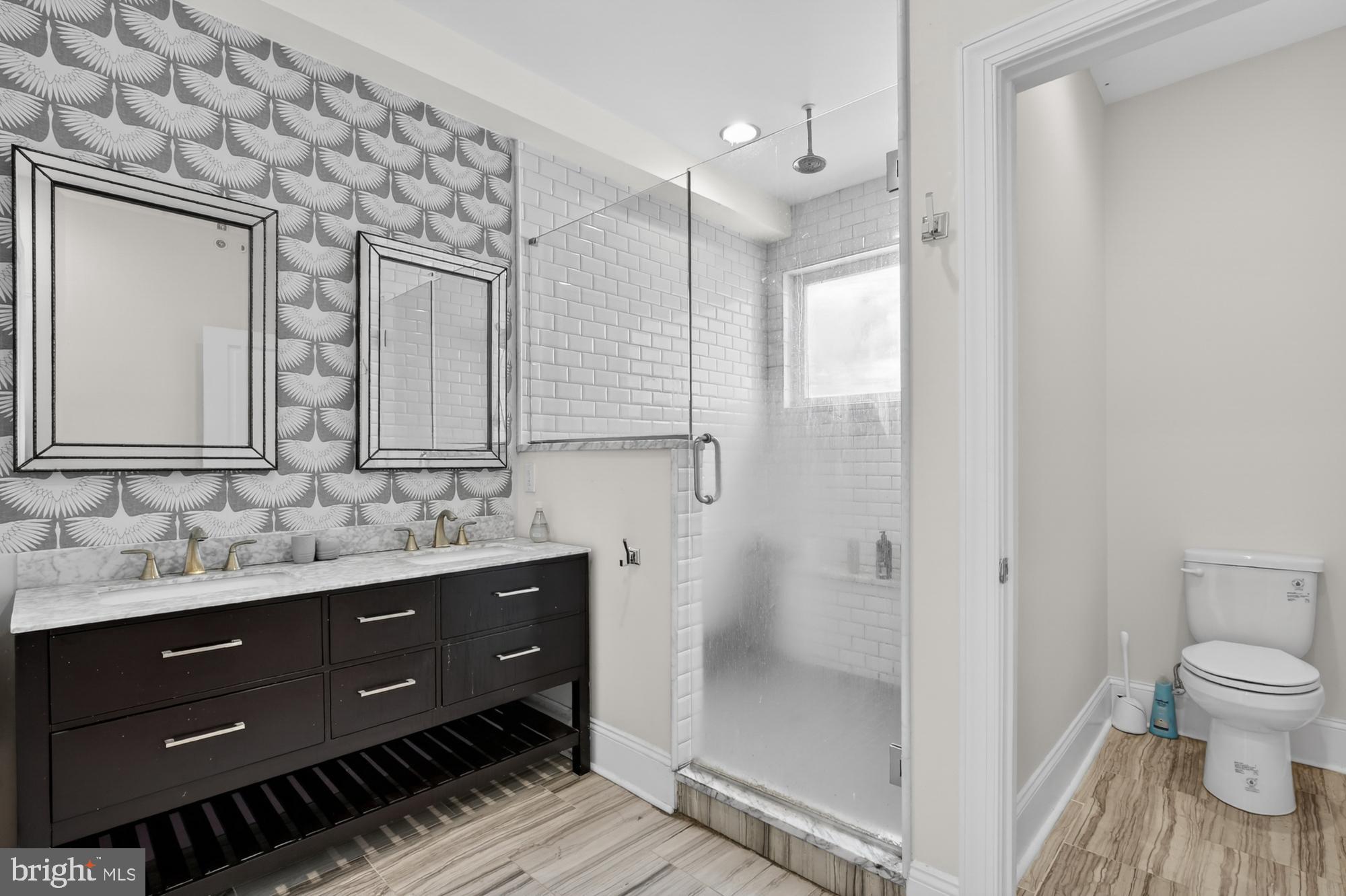 946 North 2nd Street, Unit 5 Philadelphia, PA 19123 - Photo 25 of 31 a bathroom with a double vanity sink toilet and shower