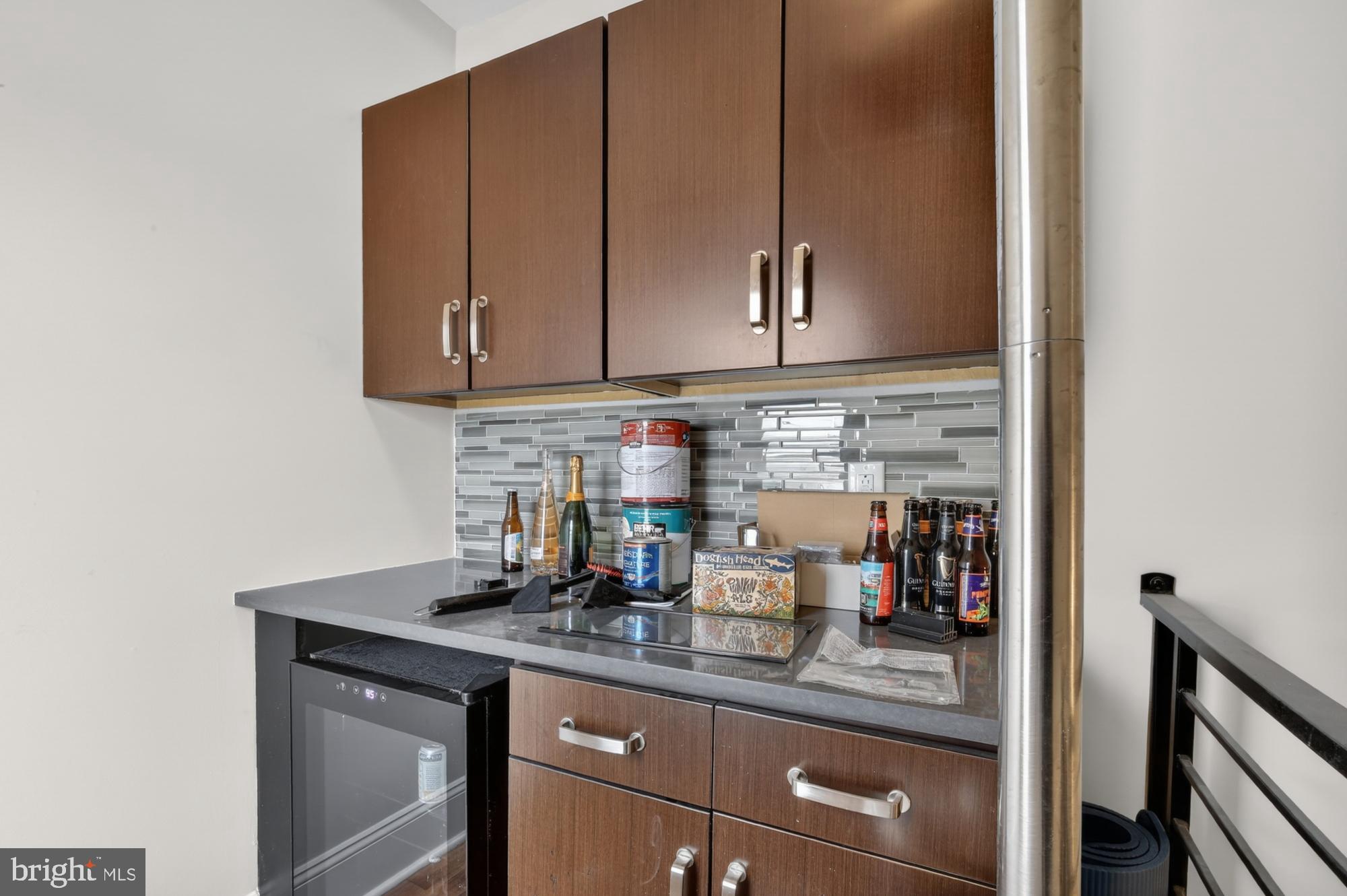 946 North 2nd Street, Unit 5 Philadelphia, PA 19123 - Photo 26 of 31 a kitchen with stainless steel appliances granite countertop a sink a stove and white cabinets