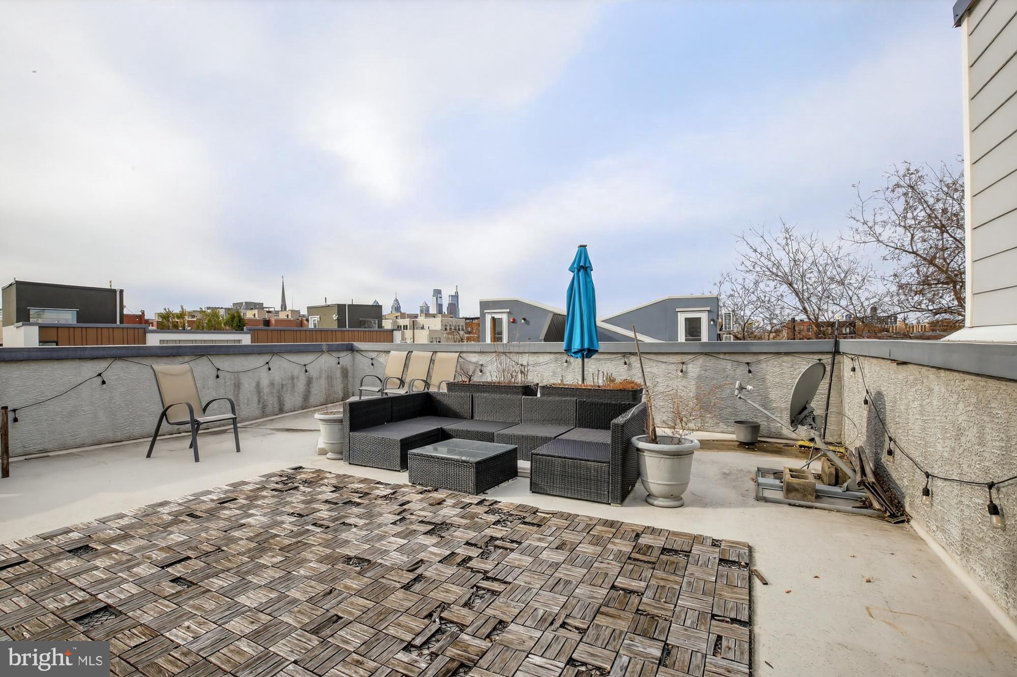 946 North 2nd Street, Unit 5 Philadelphia, PA 19123 - Photo 27 of 31 a living room with furniture a rug and a table