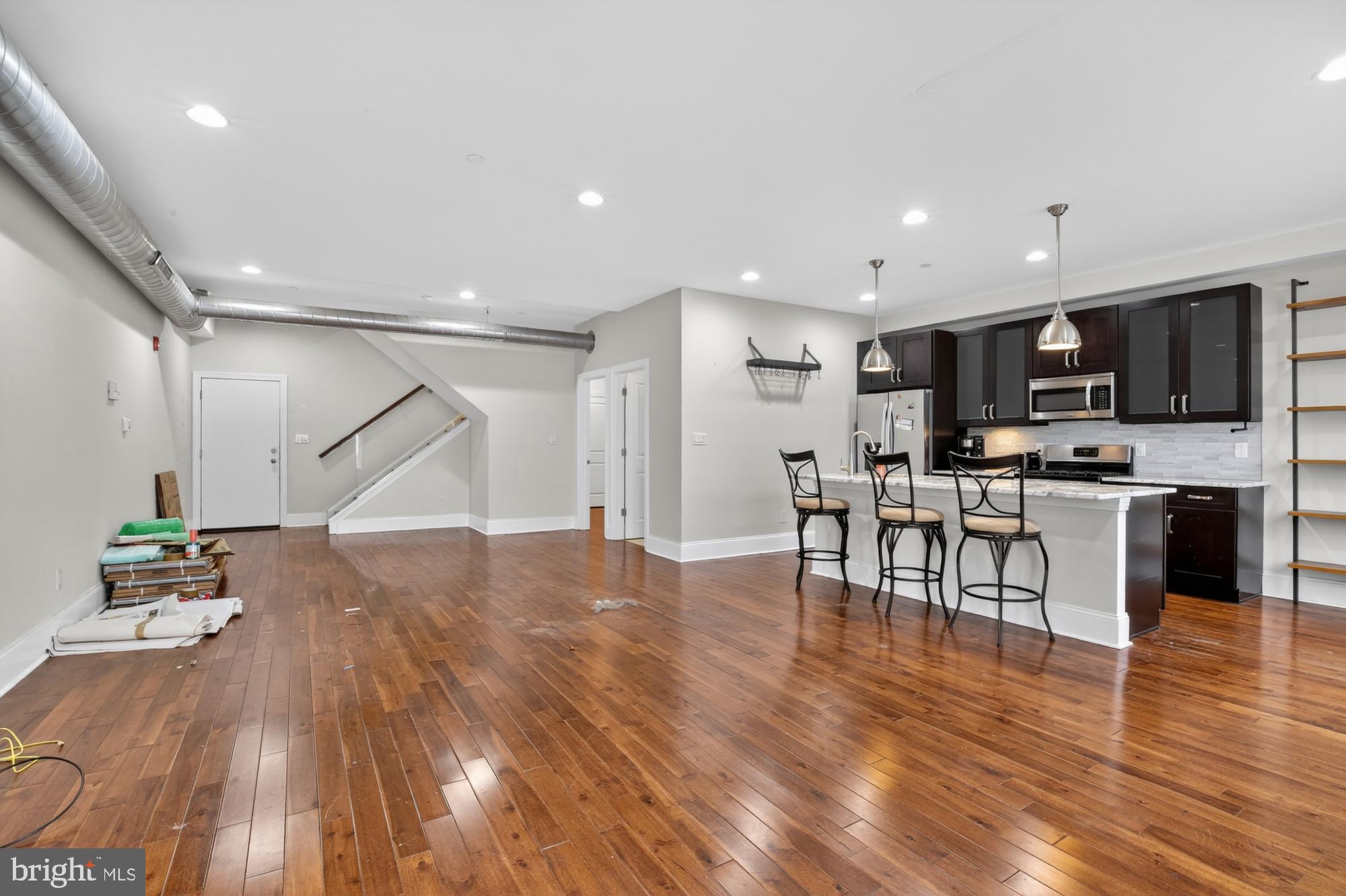 946 North 2nd Street, Unit 5 Philadelphia, PA 19123 - Photo 3 of 31 a view of kitchen and dining room with wooden floor