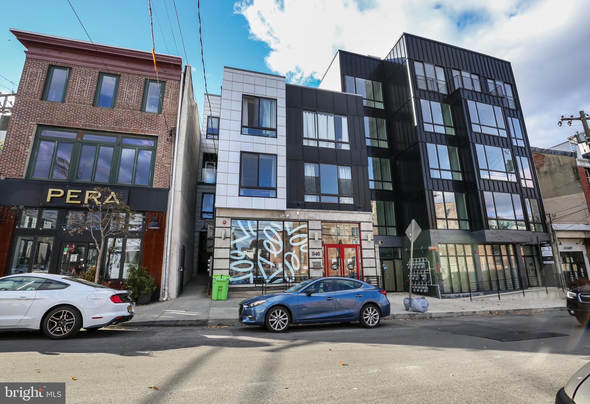 946 North 2nd Street, Unit 5 Philadelphia, PA 19123 - Photo 31 of 31 a car parked in front of a big house