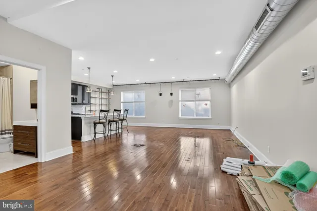 a view of dining room with furniture and wooden floor