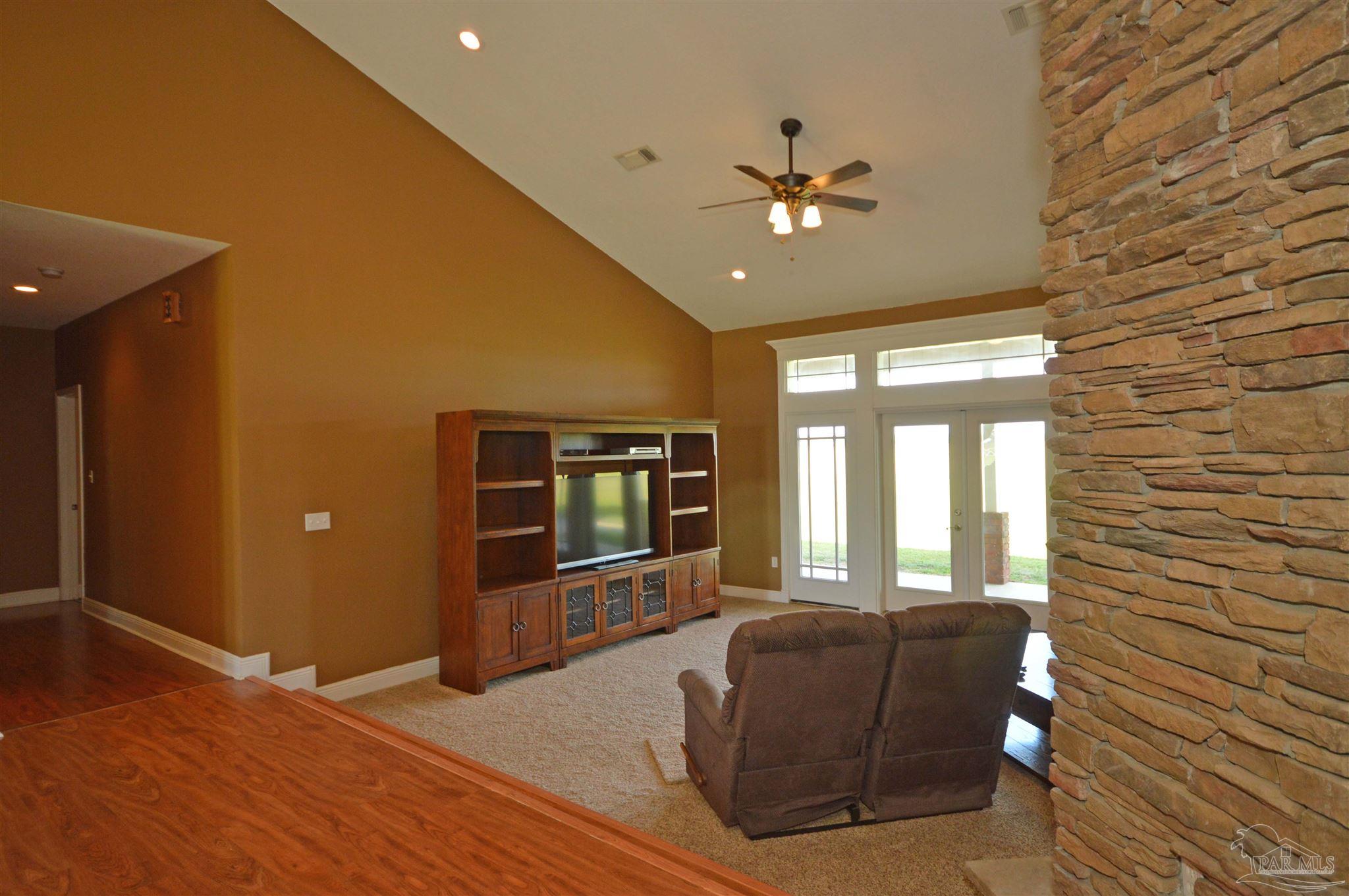 3478 Pine Level Church Road Jay, FL 32565 - Photo 10 of 50 a living room with furniture and a flat screen tv