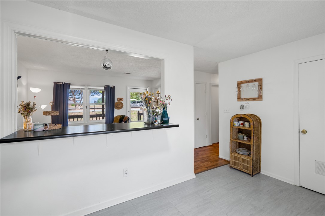 308 Clayton Street Central, SC 29630 - Photo 13 of 31 This bright space features an open pass-through window, connecting rooms with ease and inviting natural light.