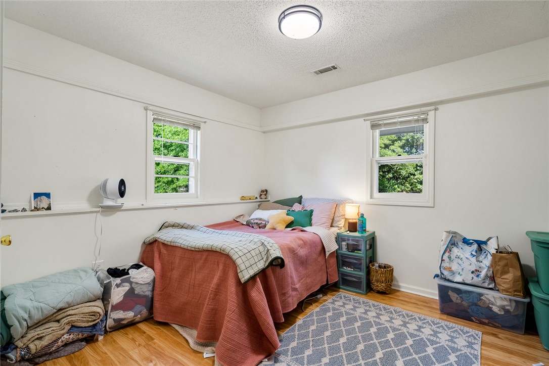 308 Clayton Street Central, SC 29630 - Photo 15 of 31 This cozy room features durable hardwood flooring and large windows, offering abundant natural light.
