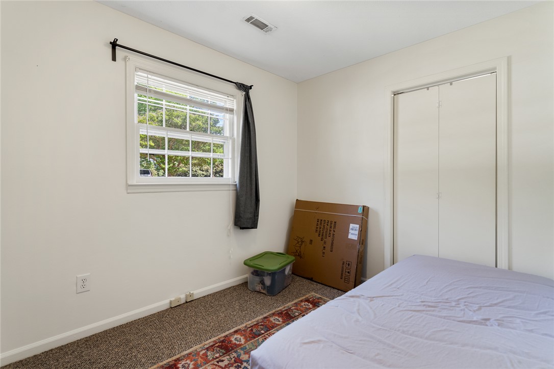 308 Clayton Street Central, SC 29630 - Photo 17 of 31 This cozy bedroom features carpeted flooring and a convenient closet, offering practical living.