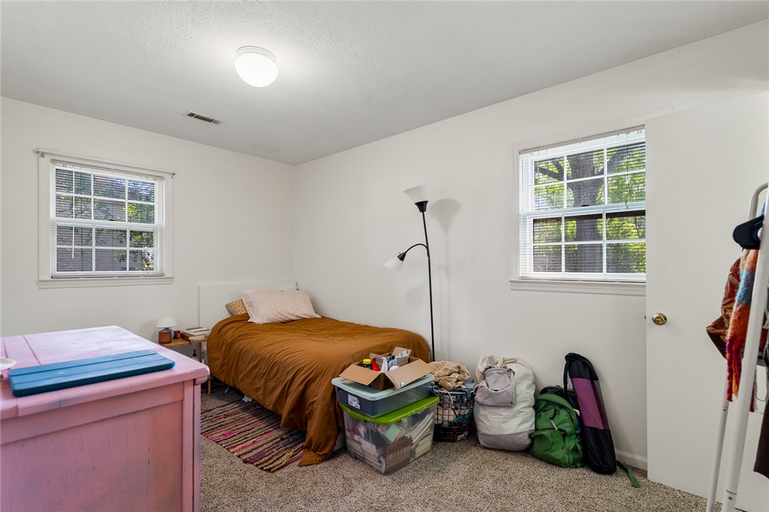 308 Clayton Street Central, SC 29630 - Photo 19 of 31 This cozy bedroom features carpeted floors and natural light from multiple windows.