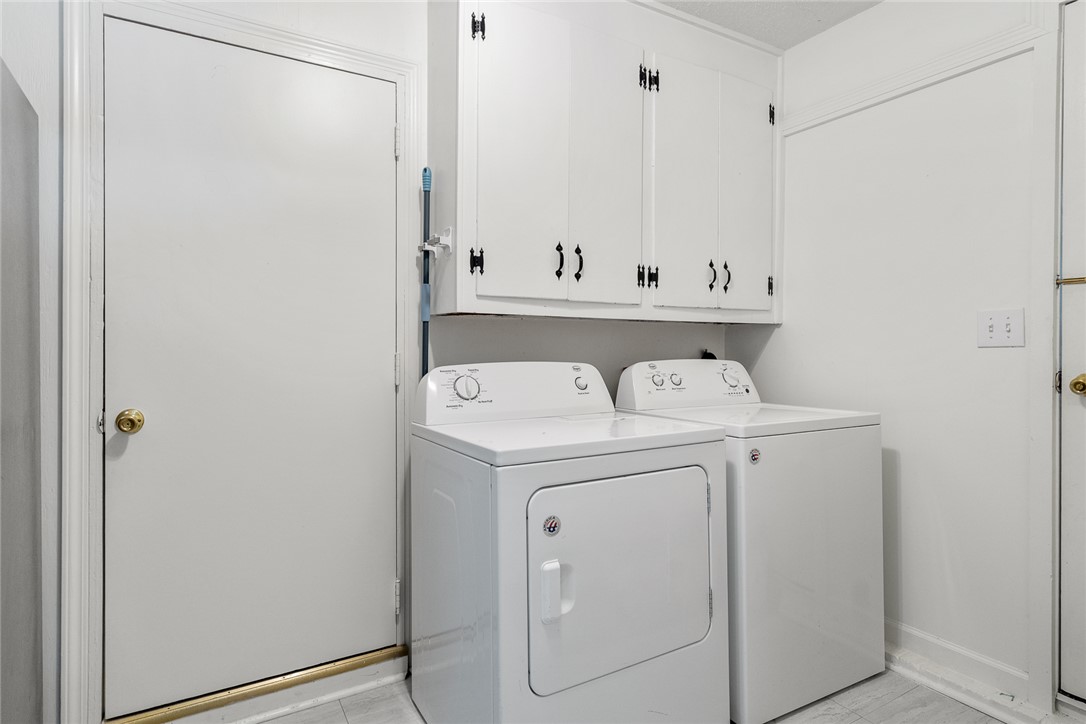 308 Clayton Street Central, SC 29630 - Photo 22 of 31 This dedicated laundry space offers convenience and ample storage for household essentials.