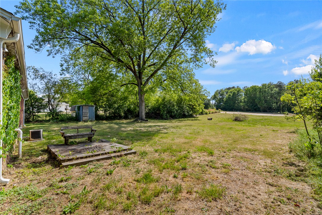 308 Clayton Street Central, SC 29630 - Photo 26 of 31 This spacious yard offers a serene setting with mature trees and ample room for outdoor activities.