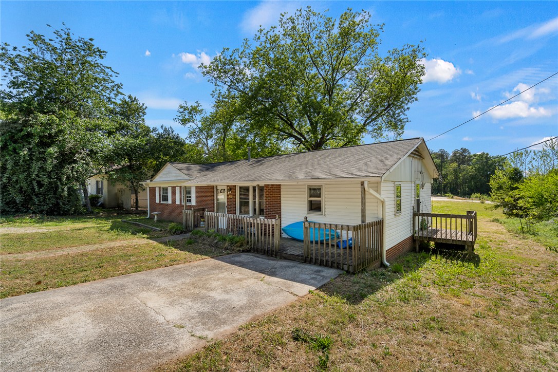 308 Clayton Street Central, SC 29630 - Photo 3 of 31 This charming home offers a spacious front yard and a welcoming porch, perfect for outdoor enjoyment.