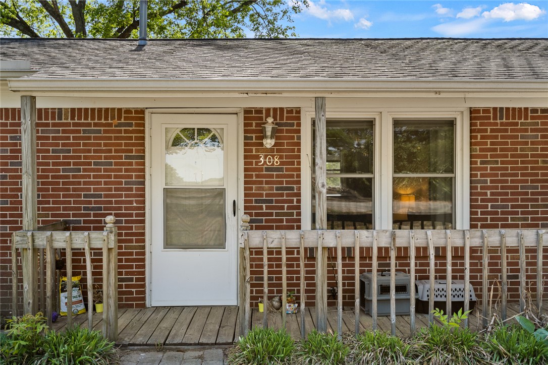 308 Clayton Street Central, SC 29630 - Photo 5 of 31 This charming home features a classic brick exterior and a welcoming porch with ample outdoor space.