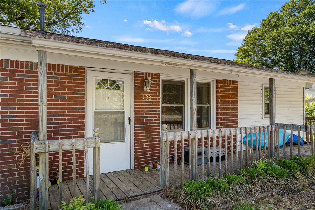 308 Clayton Street Central, SC 29630 - Photo 6 of 31 This charming residence features a classic brick and siding exterior with a welcoming porch.
