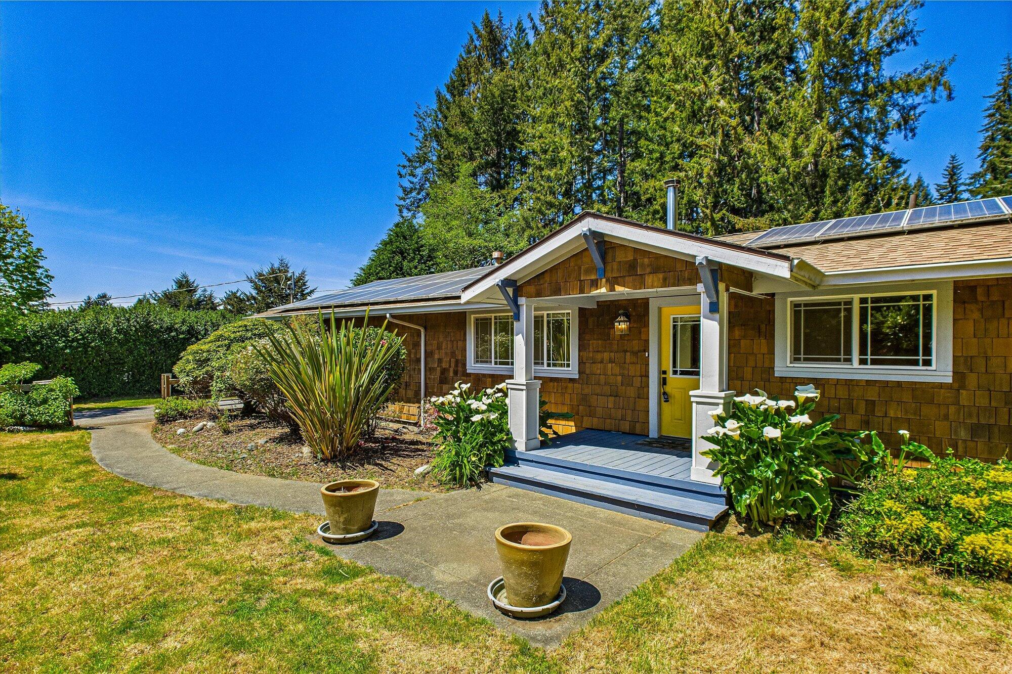 1945 Grange Road McKinleyville, CA 95519 - Photo 8 of 62 a front view of a house with garden