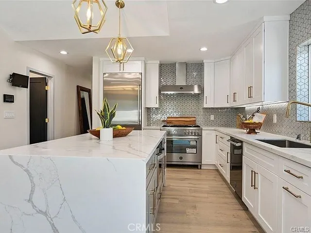 a large kitchen with a table and chairs in it
