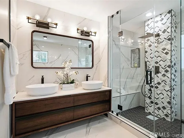 a bathroom with a bathtub and a shower