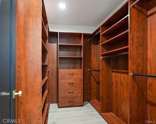 a bedroom with a bed and glass window