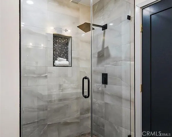 a bedroom with bed and a window