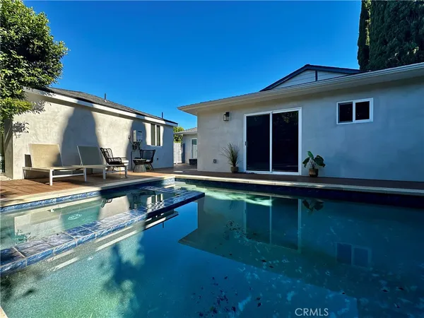 a view of a patio with furniture