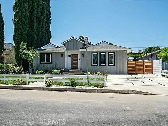 a house with a garden and pathway