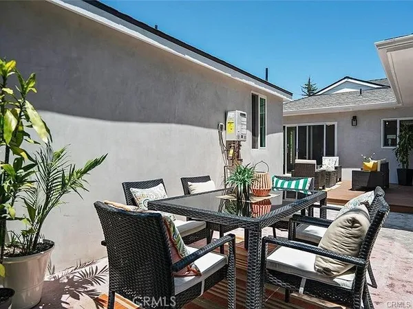 a view of a backyard with swimming pool