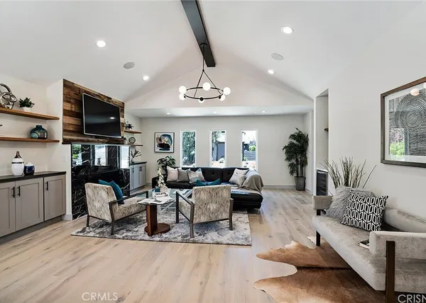 a living room with furniture or couch and a flat screen tv
