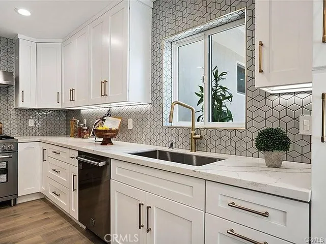 a kitchen with a sink and cabinets