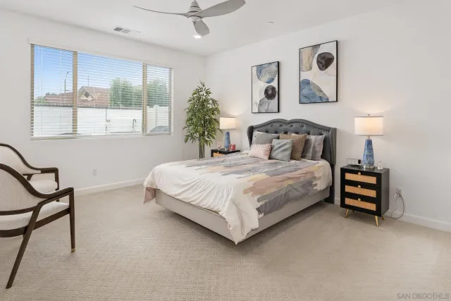 a bedroom with a bed and a table