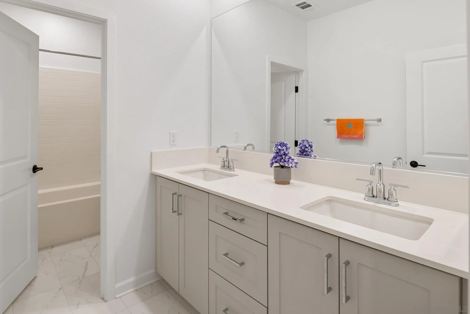 1091 Barry Place Escondido, CA 92026 - Photo 19 of 40 a bathroom with a double vanity sink a mirror and a bathtub
