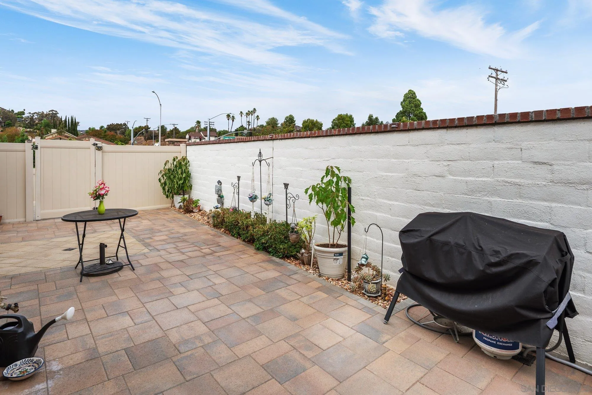 1091 Barry Place Escondido, CA 92026 - Photo 26 of 40 a view of a backyard with sitting area and lake view