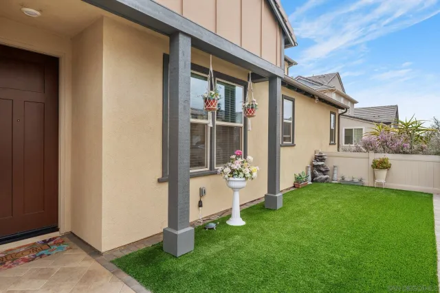 a view of a front of a house with a yard