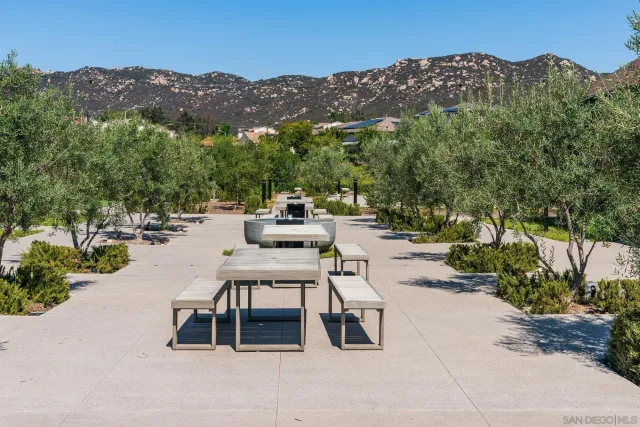 a view of a garden with a house