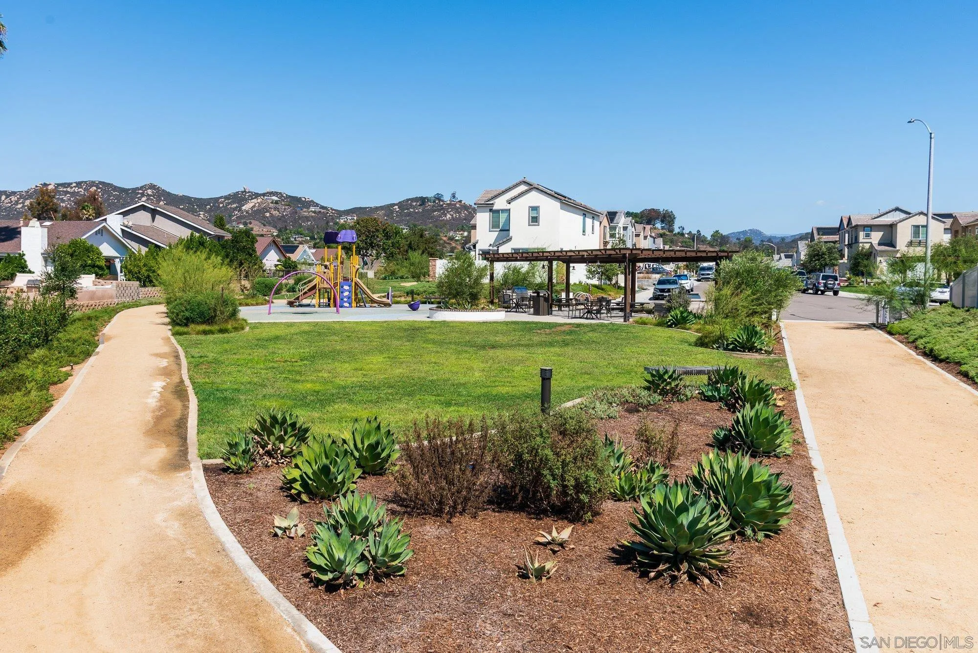1091 Barry Place Escondido, CA 92026 - Photo 35 of 40 a view of a garden with a house