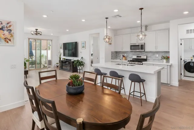 a view of kitchen with dining table and chairs