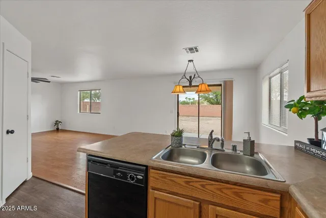 a kitchen with a sink and a window