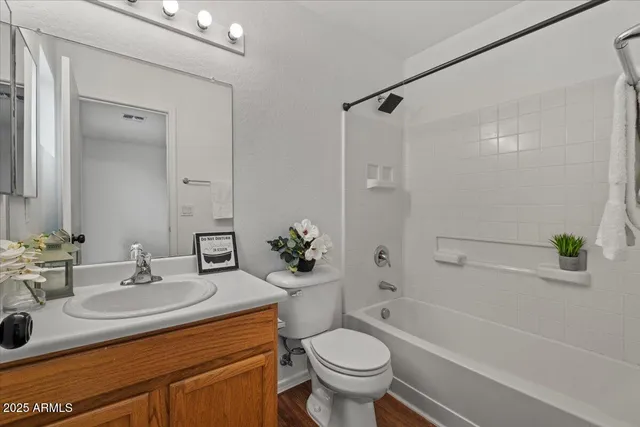 an empty room with a window and a ceiling fan