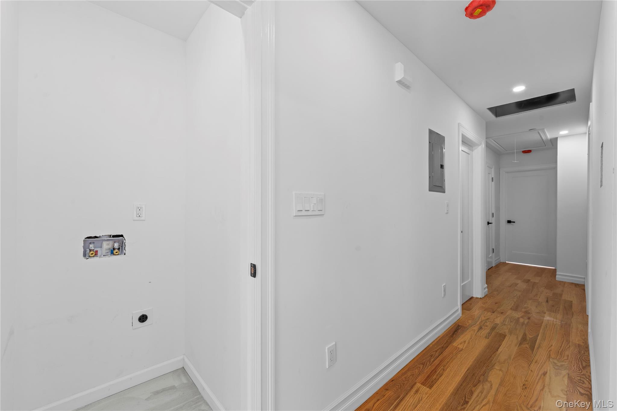 258-14 147th Road Queens, NY 11422 - Photo 11 of 17 a view of hallway with wooden floor
