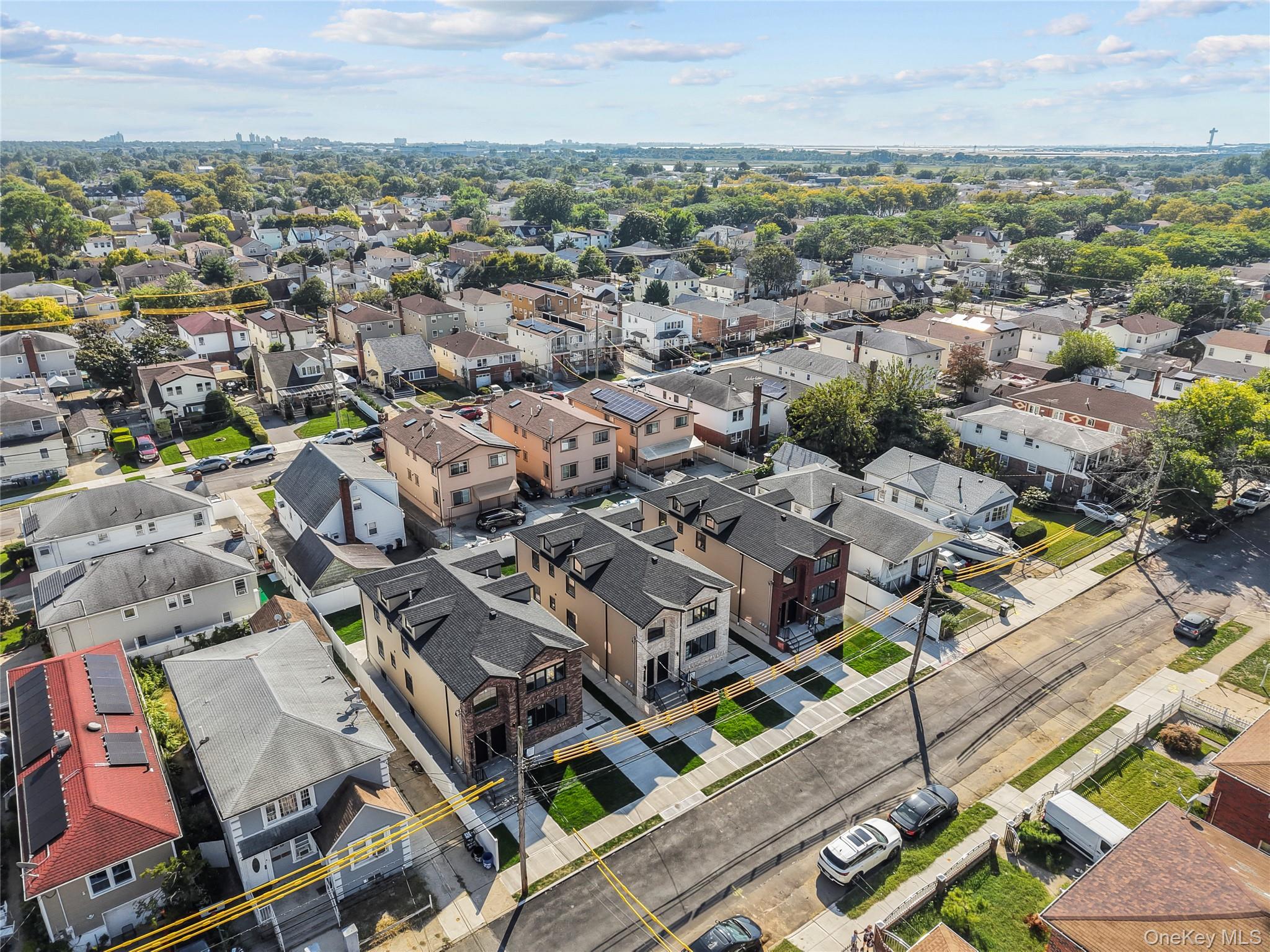 258-14 147th Road Queens, NY 11422 - Photo 14 of 17 an aerial view of a city with lots of residential buildings