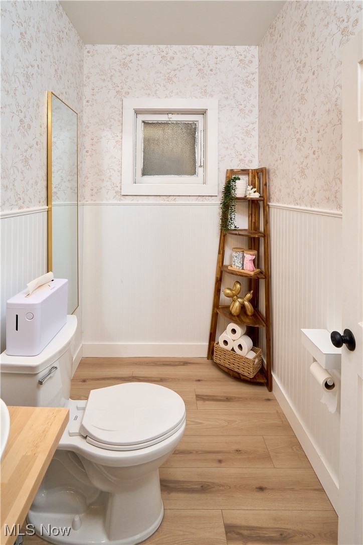 5432 State Road Parma, OH 44134 - Photo 12 of 47 Bathroom with light wood finished floors, a wainscoted wall, and vanity