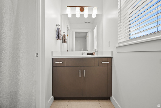 15008 South Springtime Road Draper, UT 84020 - Photo 26 of 37 Bathroom with vanity and light tile patterned floors