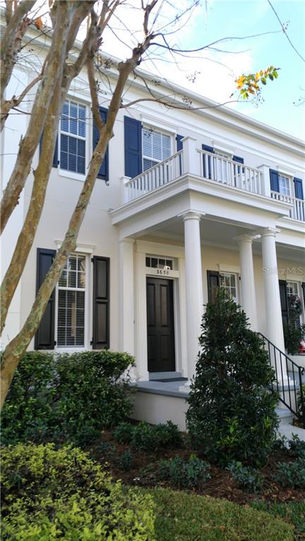3650 Lower Union Road, Unit 4 Orlando, FL 32814 - Photo 1 of 1 a view of a white house with large windows and plants